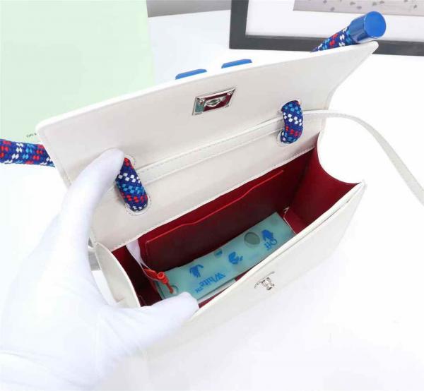 Off White Leather Insert Gummy white with Metallic Blue Arrows At Front. Rope Handle Jitney 1.4 Shoulder Bag (D88532 White)