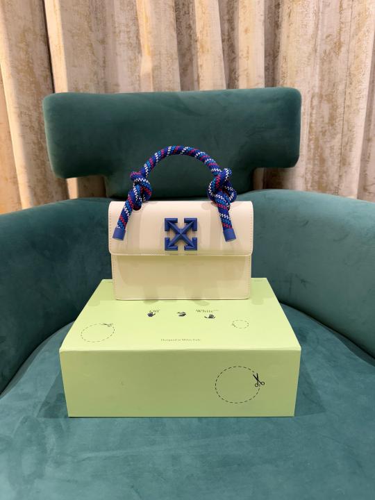 Off White Leather Insert Gummy white with Metallic Blue Arrows At Front. Rope Handle Jitney 1.4 Shoulder Bag (D88532 White)