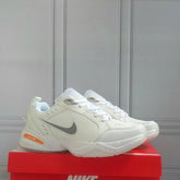 Nikee Air monarch iv snow day white total orange metallic silver