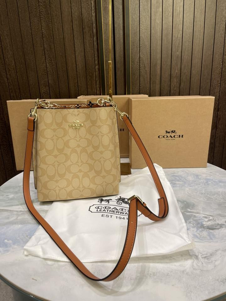 Coac  h mollie signature bucket bag with extra long sling and carry bag & OG box 478