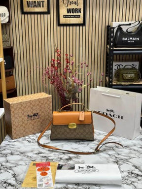 COAC  H ELIZA TOP HANDLE SLING WITH OG BOX AND DUST BAG WITH CARRY BAG (BROWN)