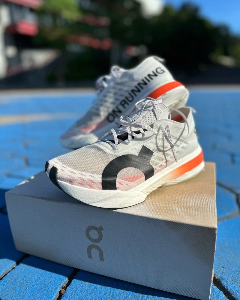 On Cloudboom Strike White Orange