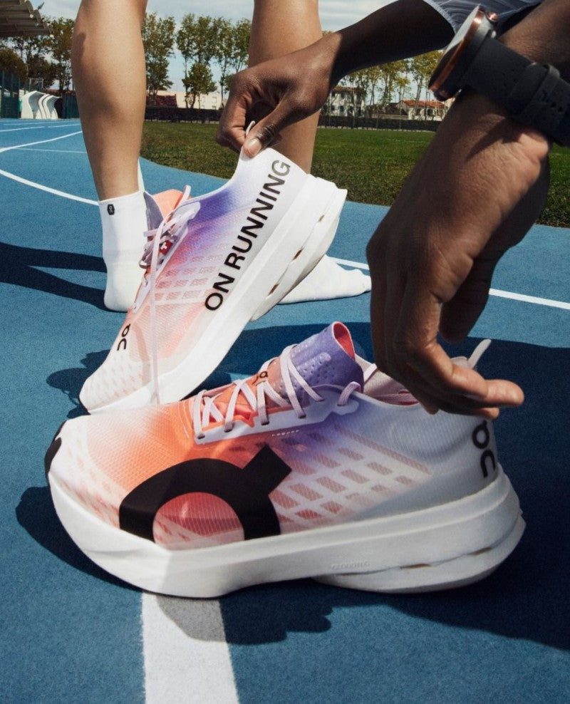 On Cloudboom Strike White Flame with cloud extra insole