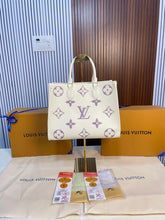 louis vuitton with magnetic box onthego mm monogram empreinte giant bicolour 14