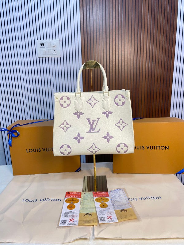 louis vuitton with magnetic box onthego mm monogram empreinte giant bicolour 14